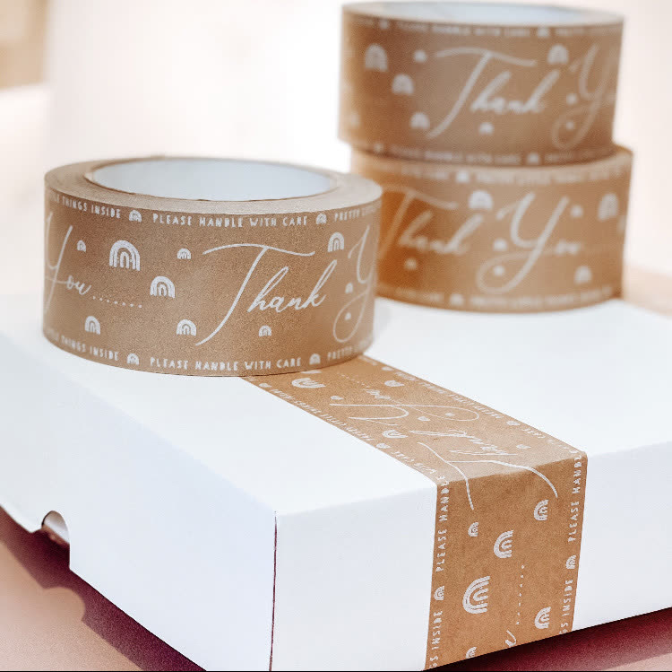 Custom printed Thank You script tape with rainbow pattern on a white box